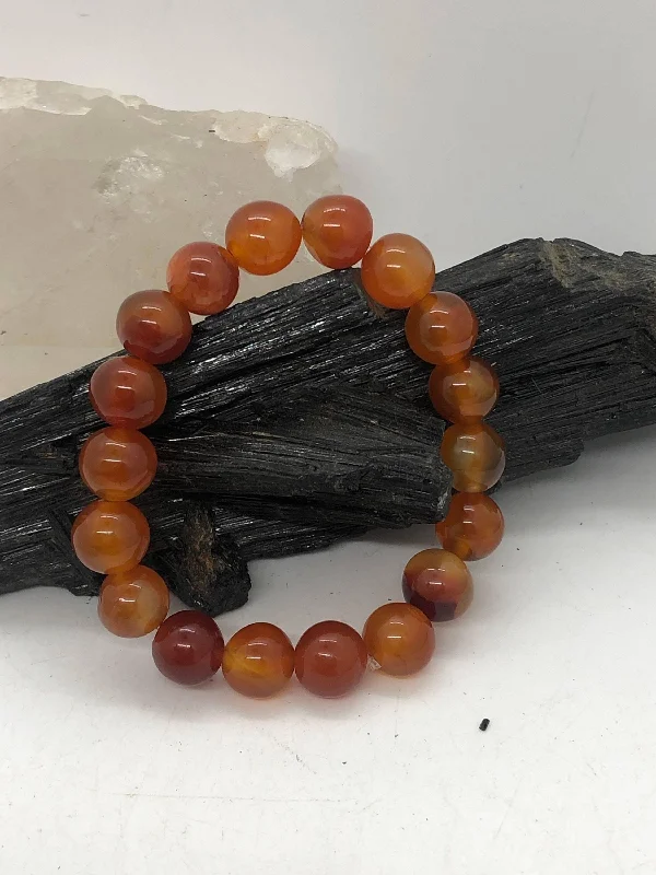 Ladies Bracelets Crafted Glow-Carnelian 10 mm Stretchy Bracelet