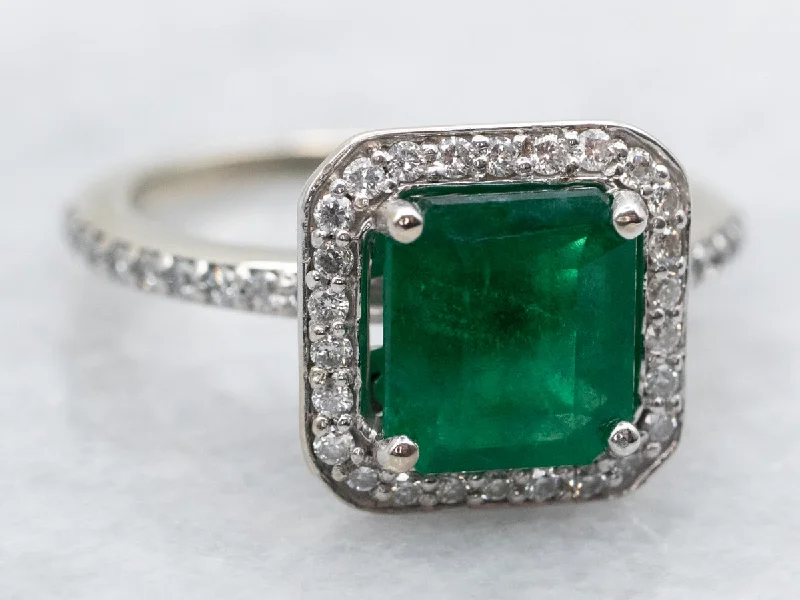 Ladies Heavy Engagement Rings -Modern Emerald and Diamond Halo Engagement Ring